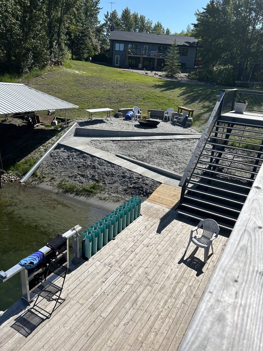 The dock and fire pit at Shalom Park - three generations gathering at the family waterski estate