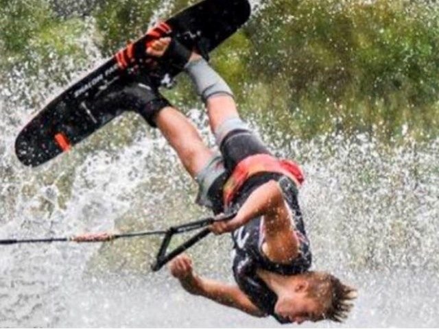 Evan Kraus inverted over the Shalom Park lake during competition