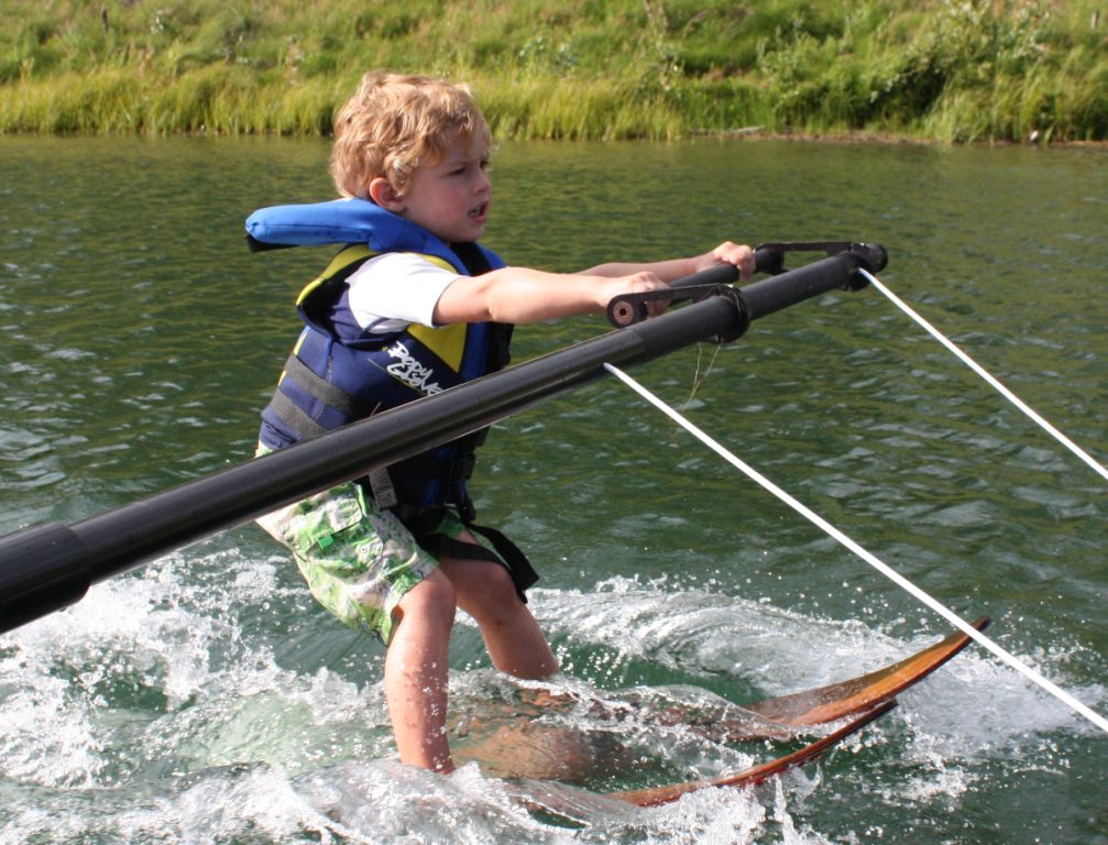Young child learning to waterski on the boom at Shalom Park - proof that anyone can do this