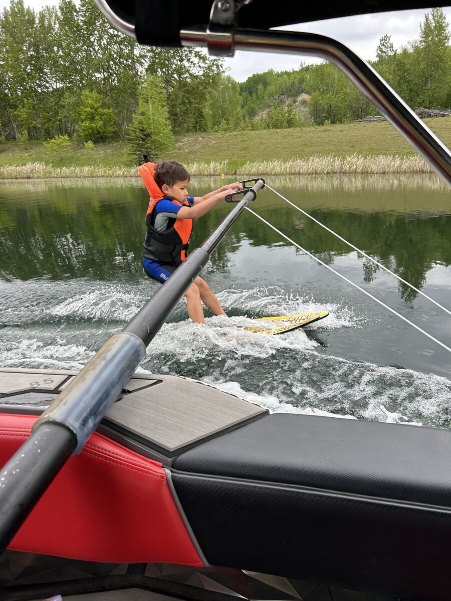Young skier being coached on the water at Shalom Park - where every generation begins