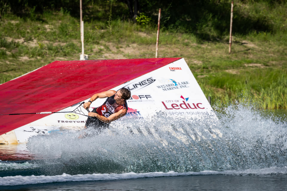 Skier blasting off the jump ramp at the 2026 Canadian Open at Shalom Park