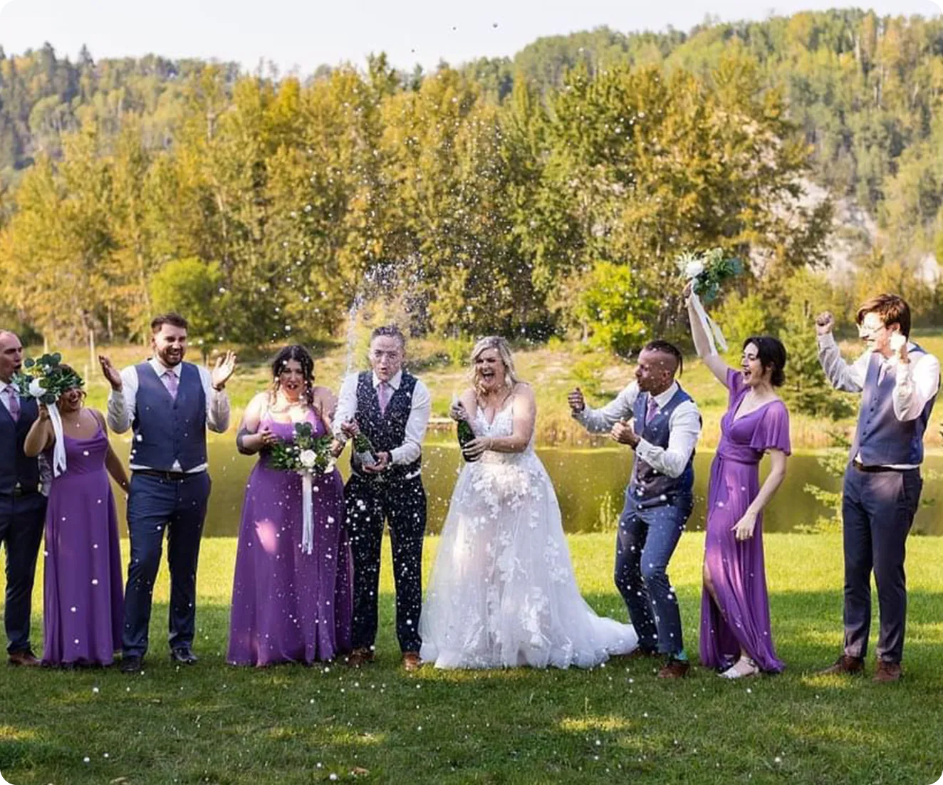 A group of people standing on top of a grass covered field.