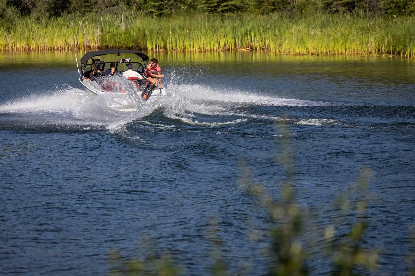 A person is water skiing on the lake.