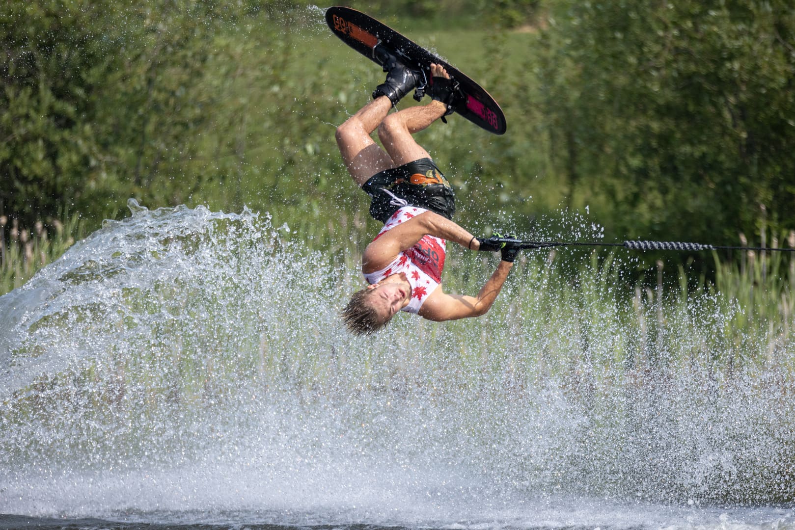 A person on water skis in the air.