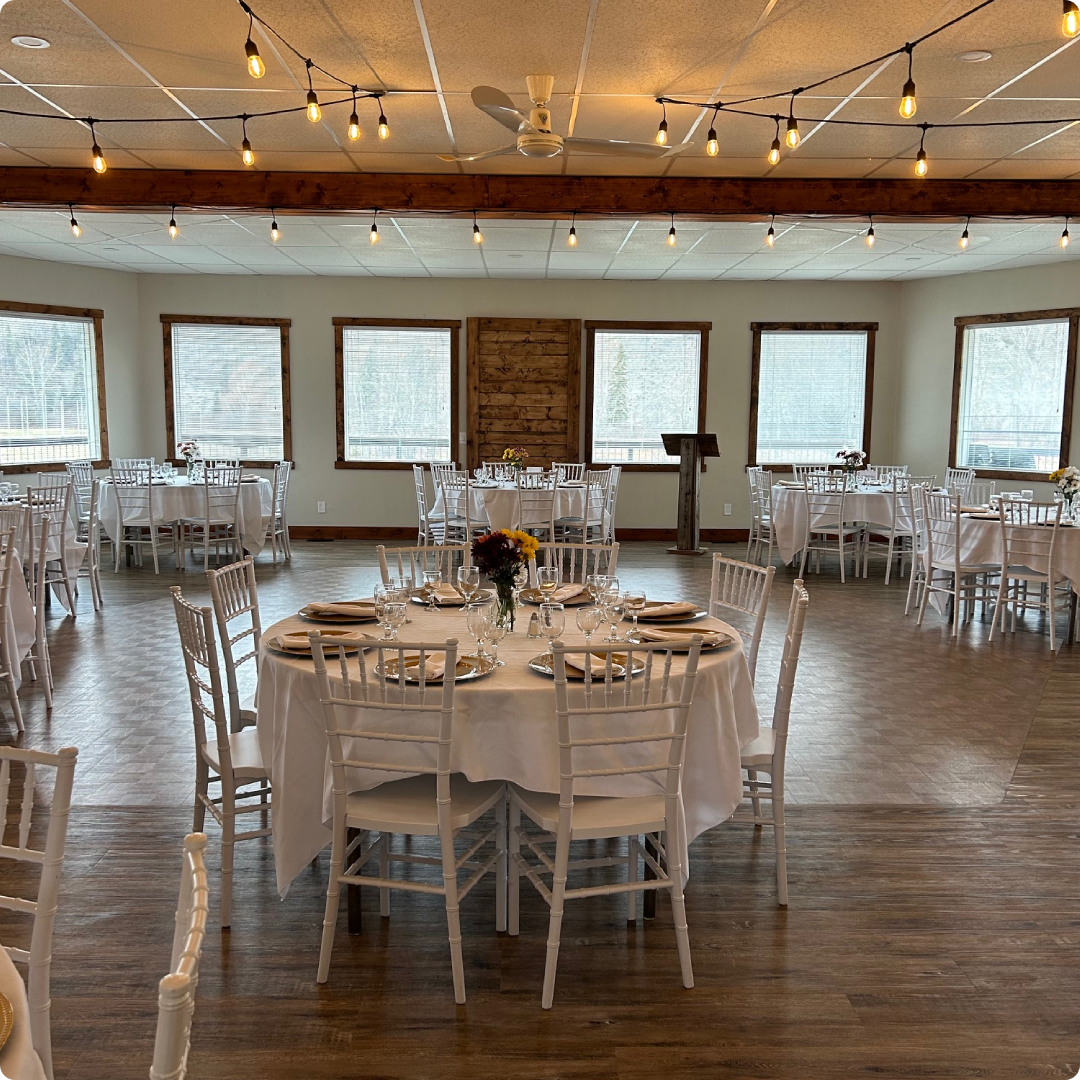 A large room with many tables and chairs