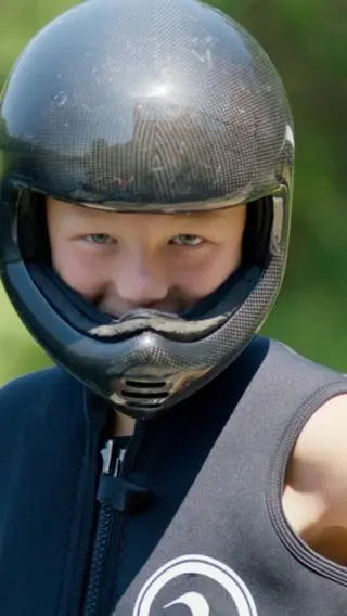 A person wearing a helmet and vest