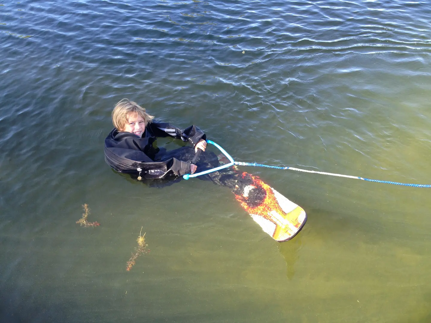 A person in the water holding onto a rope