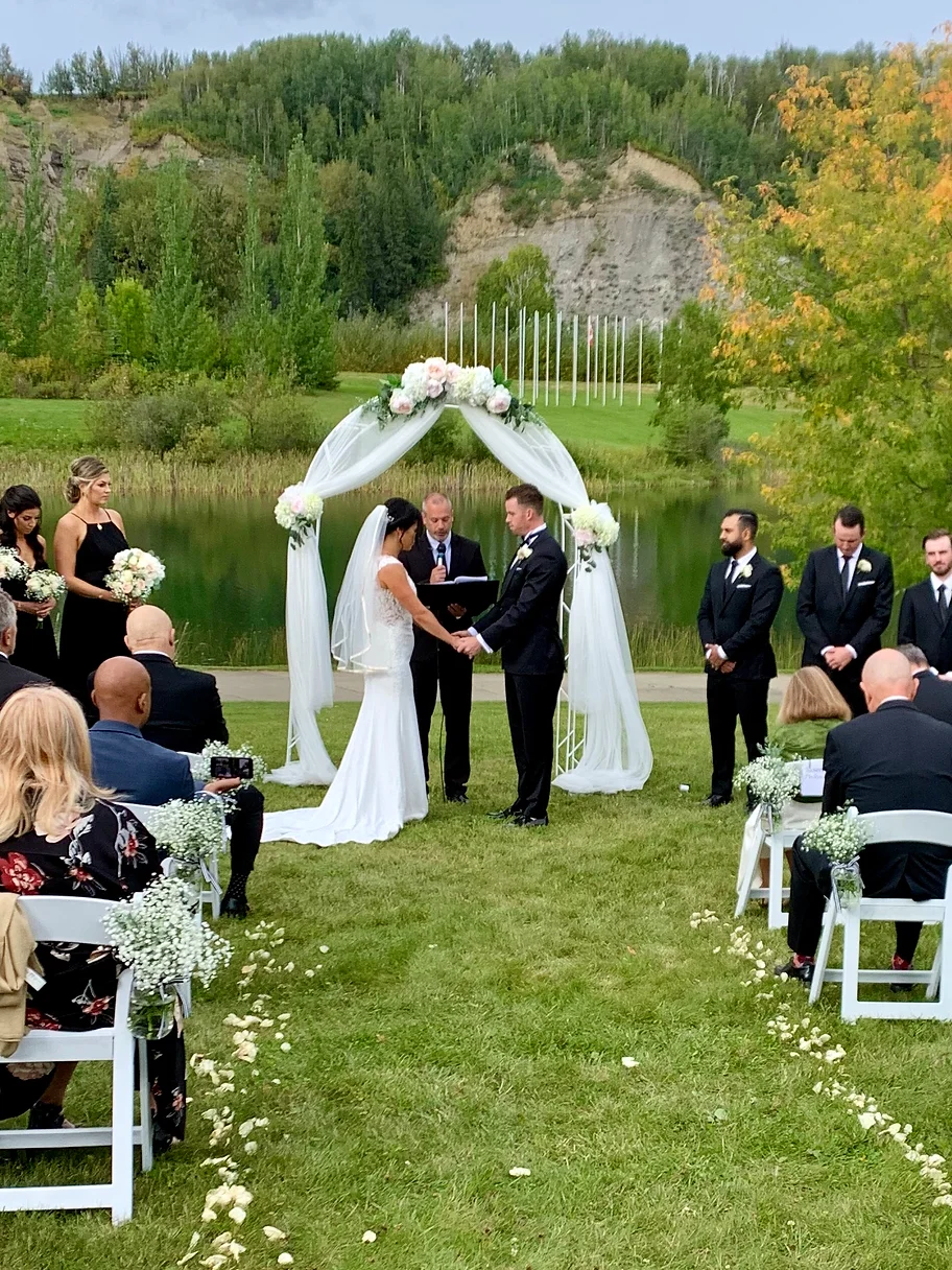 A couple getting married in front of their guests.