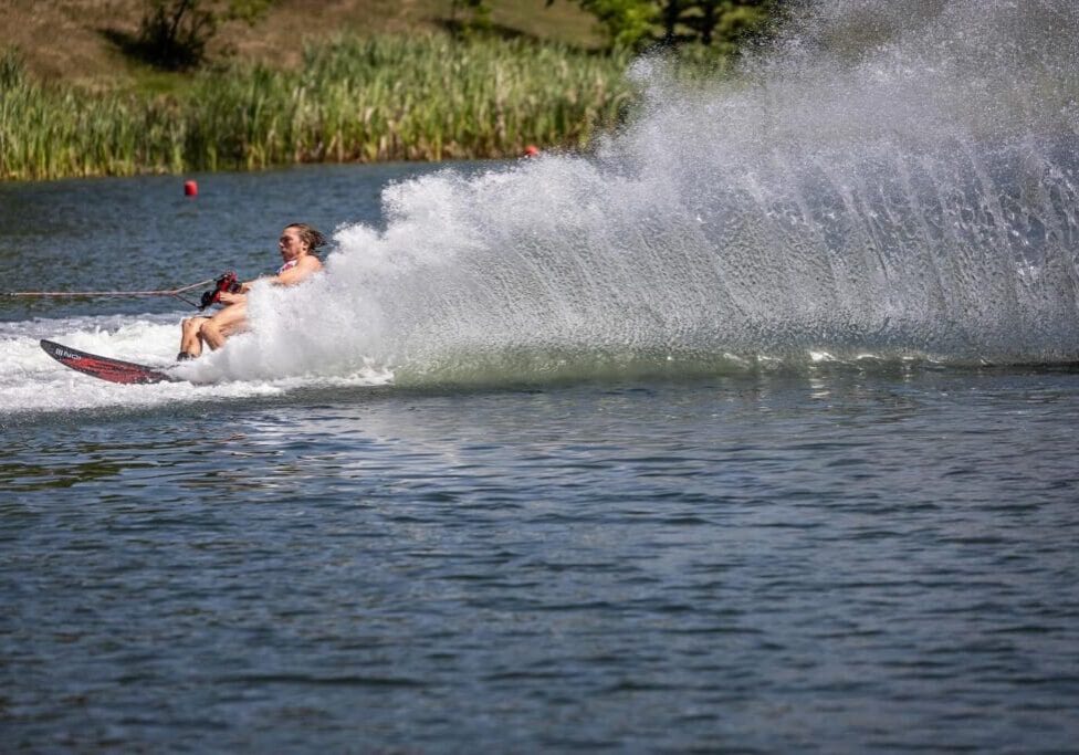 A person on skis is being pulled by a boat.