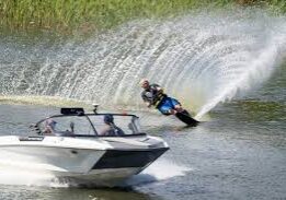 A person is water skiing behind a boat.